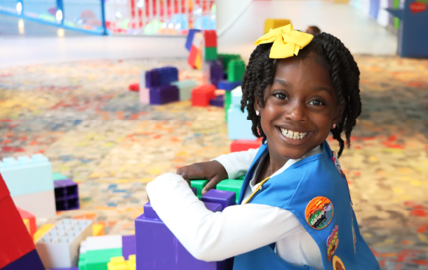 young Daisy playing with giant blocks