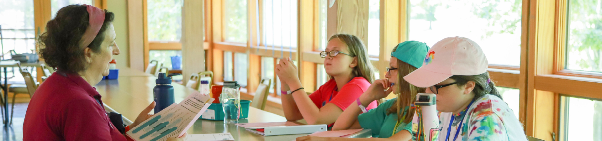  young Girl Scouts listening to a presentation 