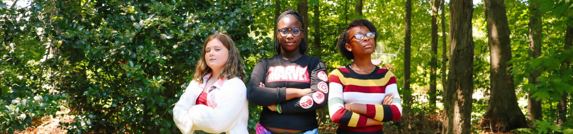  three girls pose confidently 